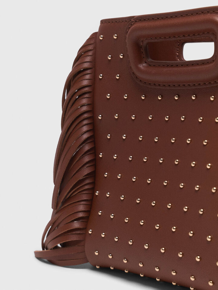 Bolso M mini de cuero y tachuelas