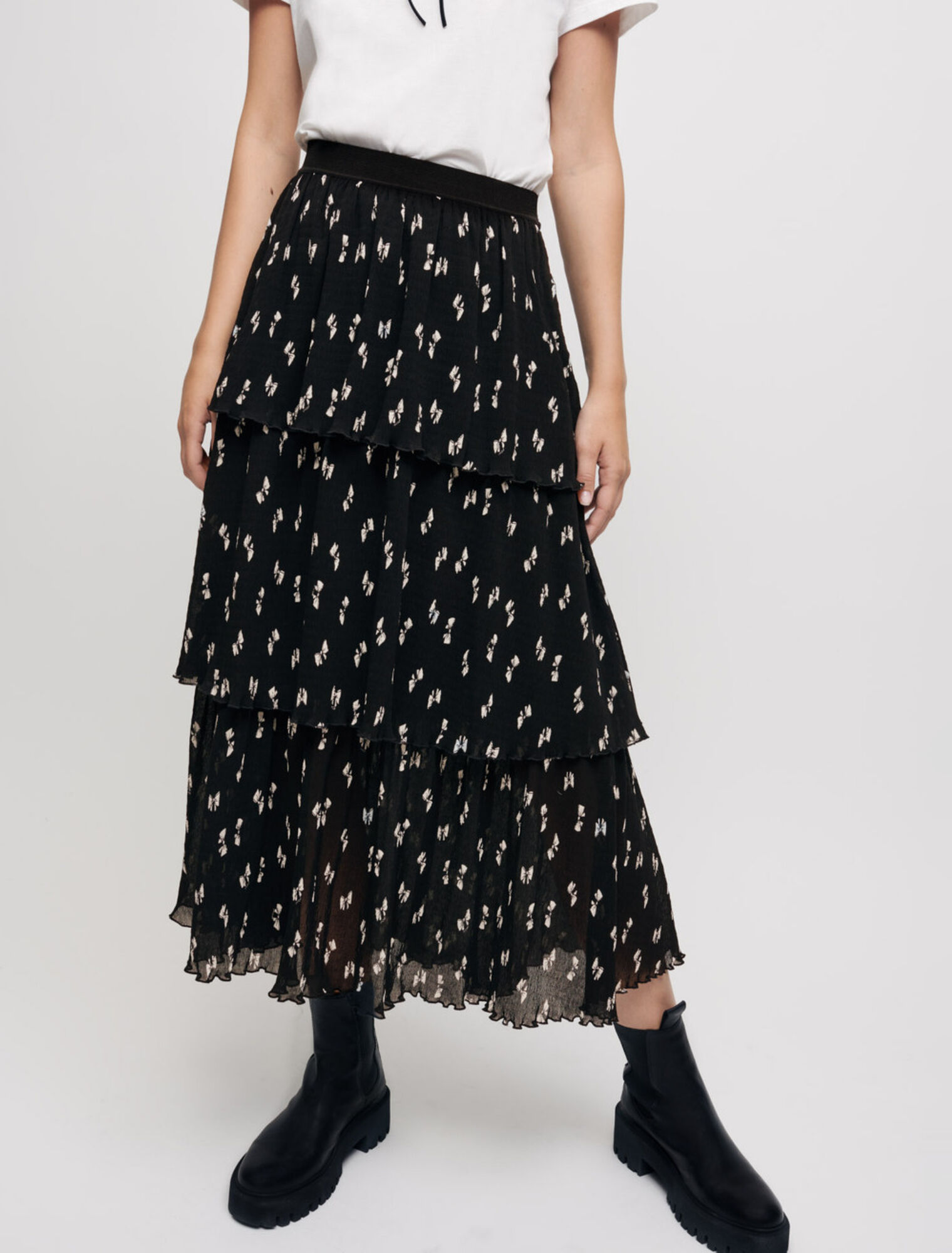 Minifalda plisada con estampado de lazos
