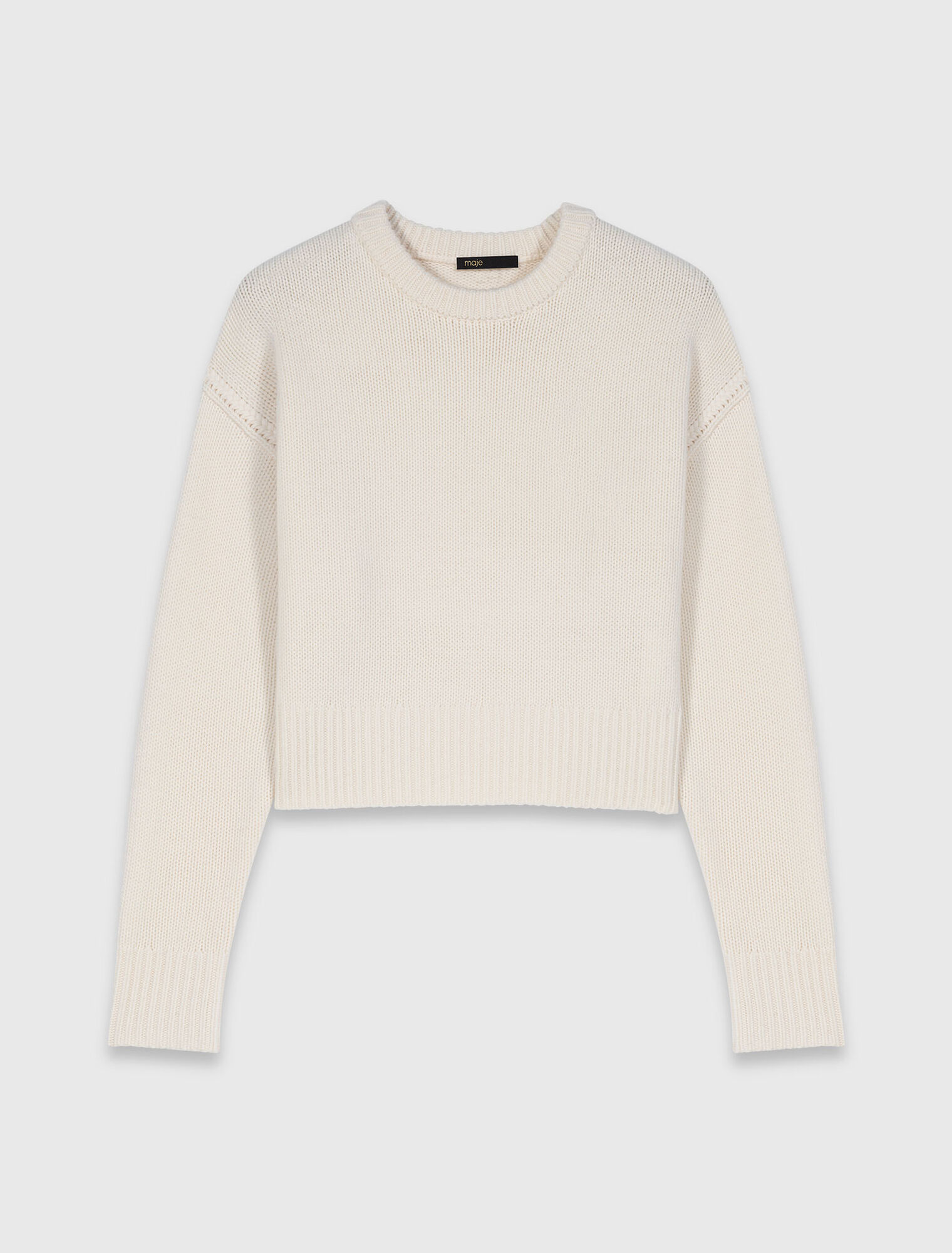 Jersey con broche floral