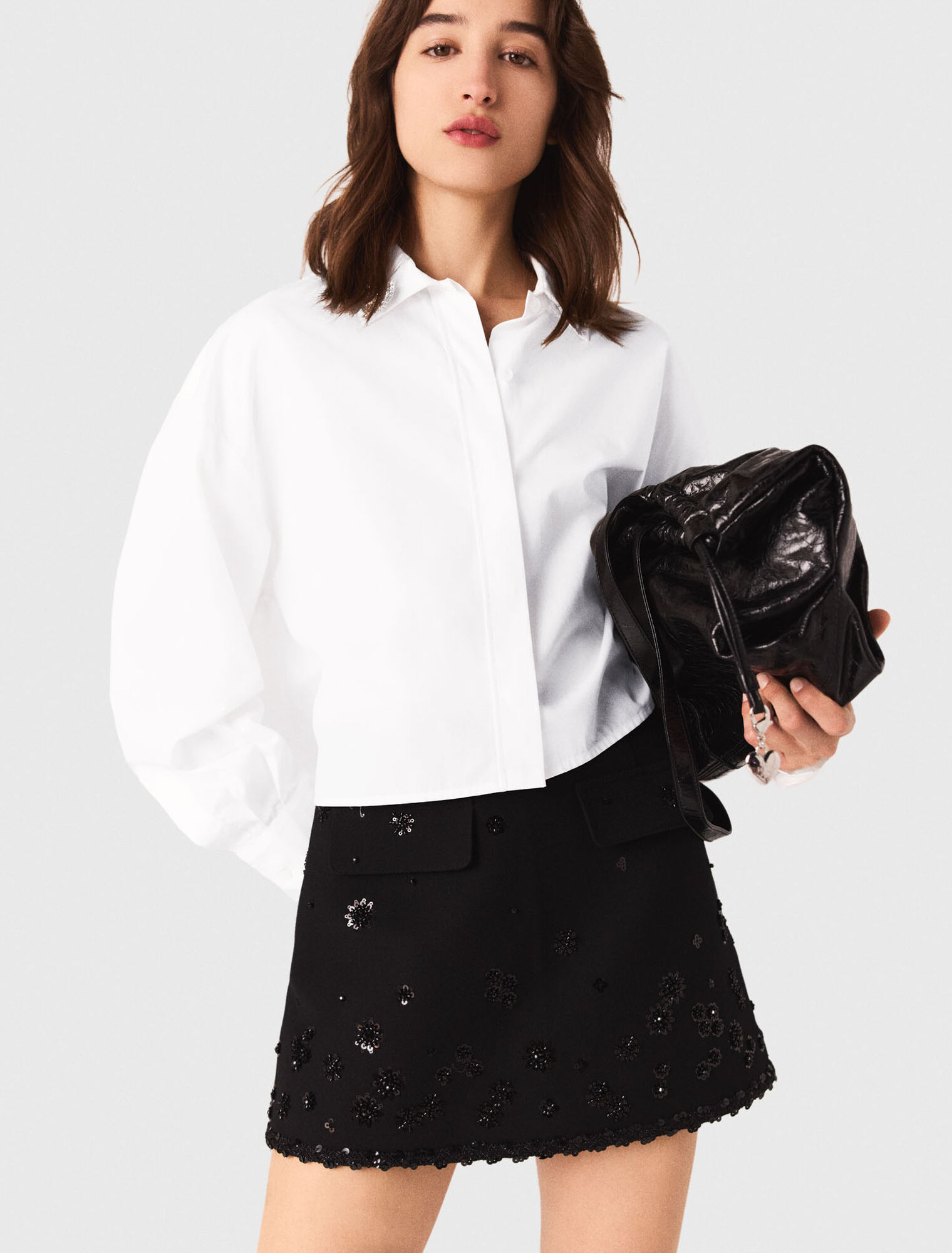 Pantalón corto trampantojo bordado