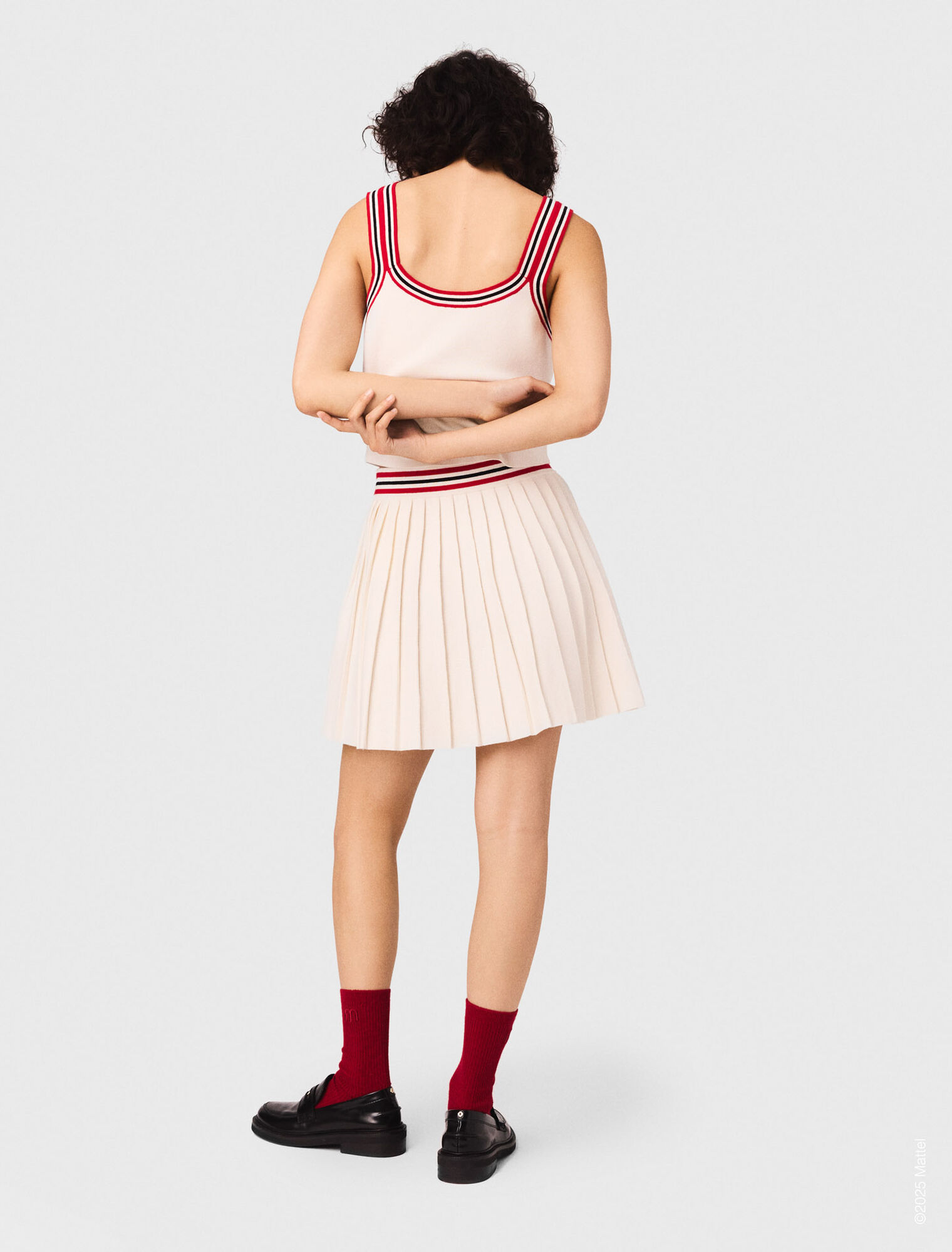 Falda corta plisada de punto