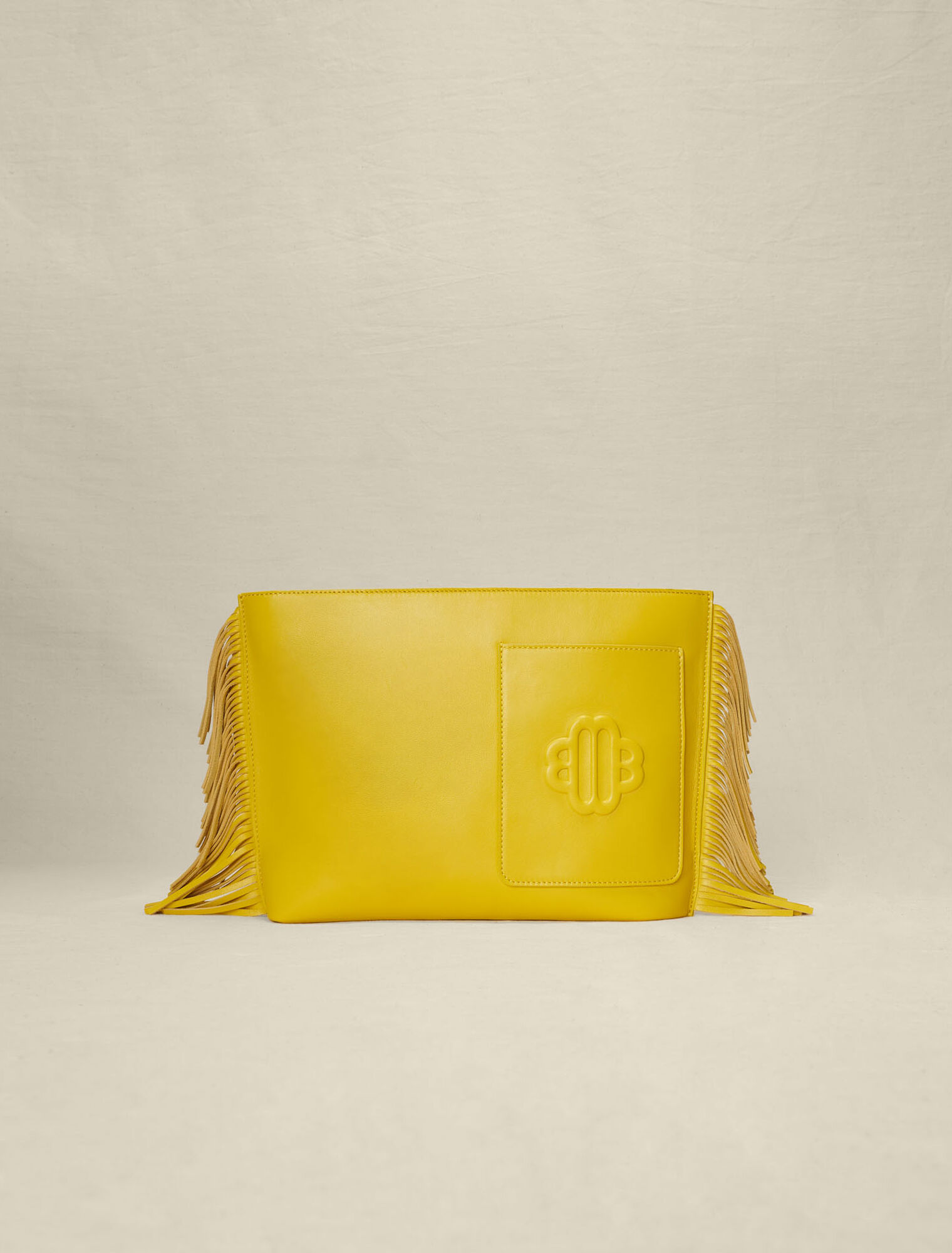 Bolso de mano de piel con flecos