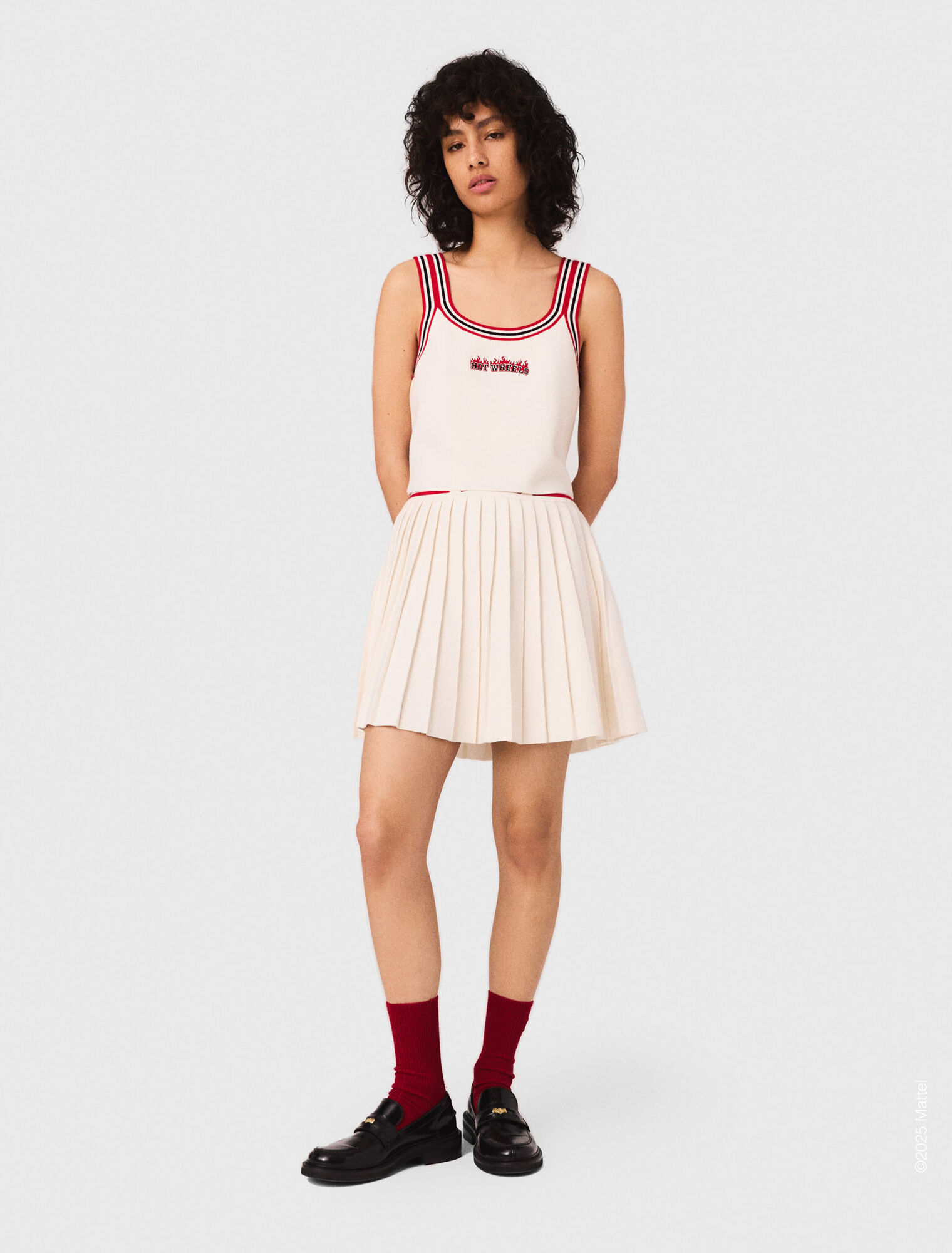 Falda corta plisada de punto