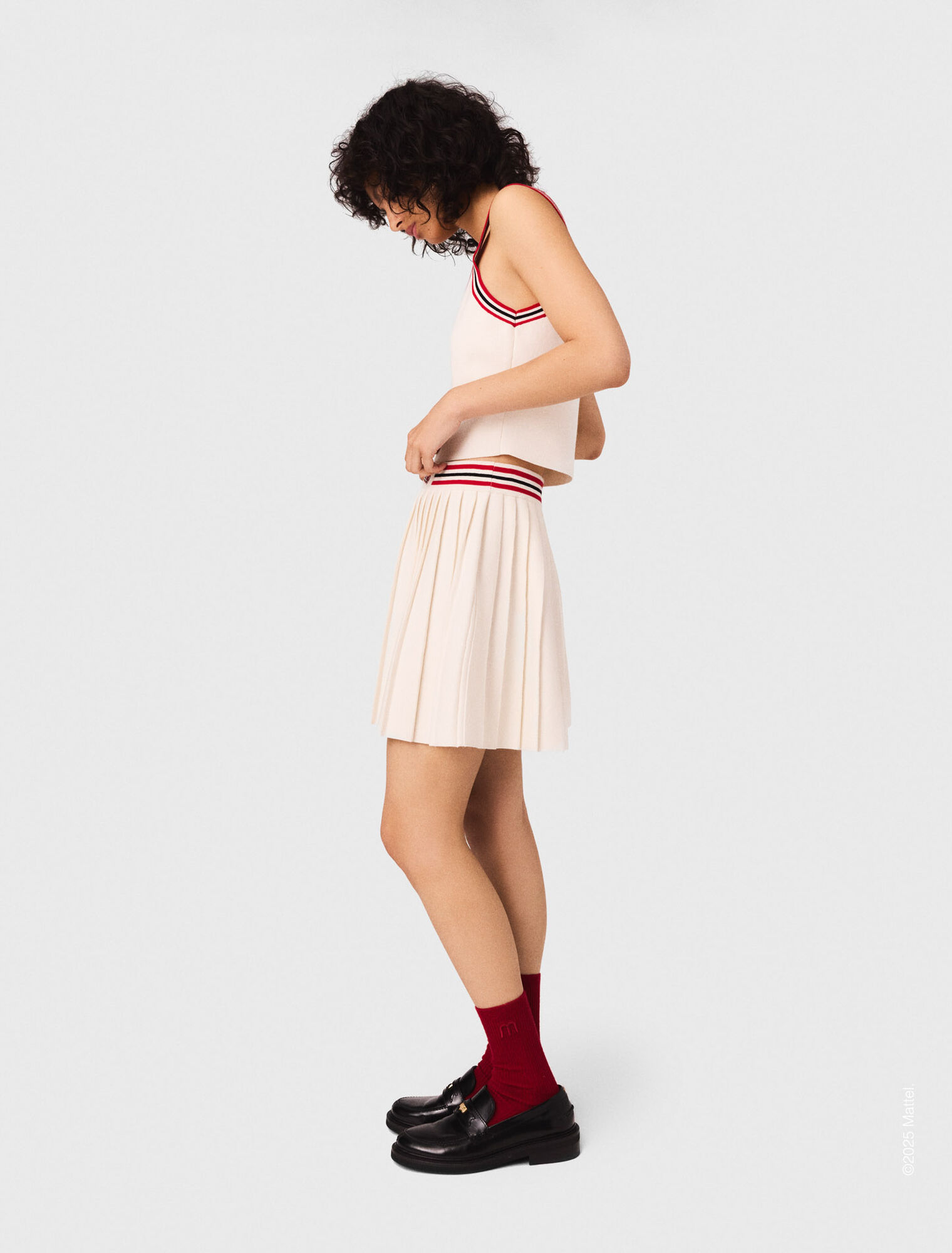 Falda corta plisada de punto