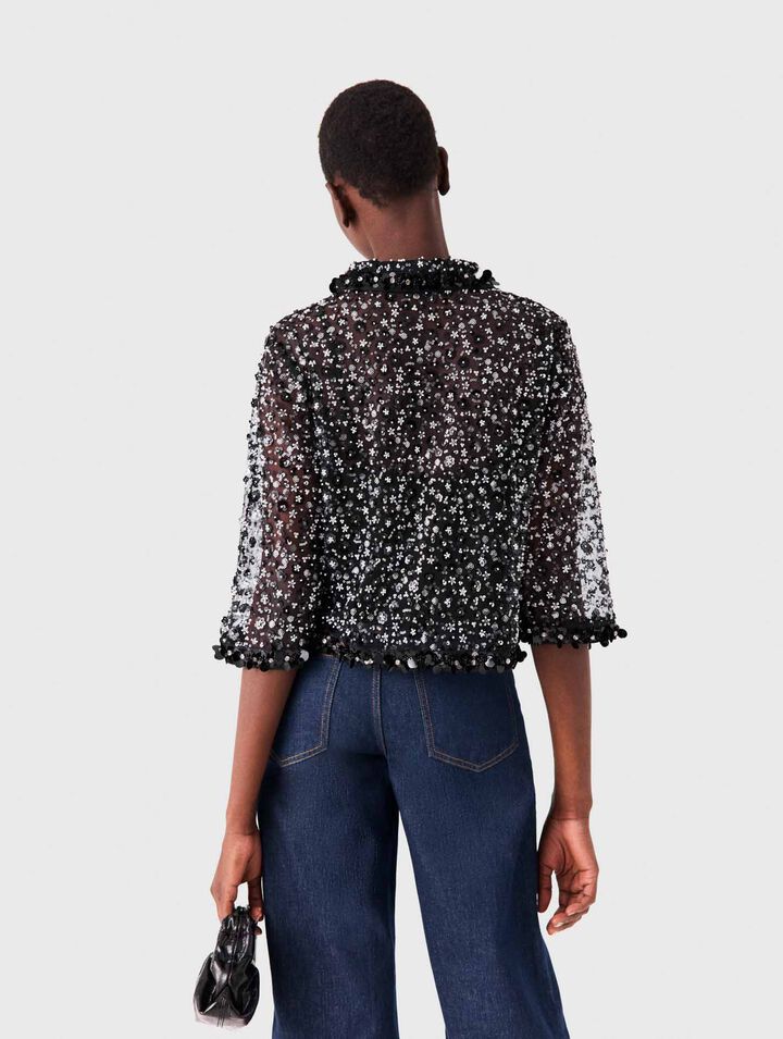 Polo con estampado floral y strass