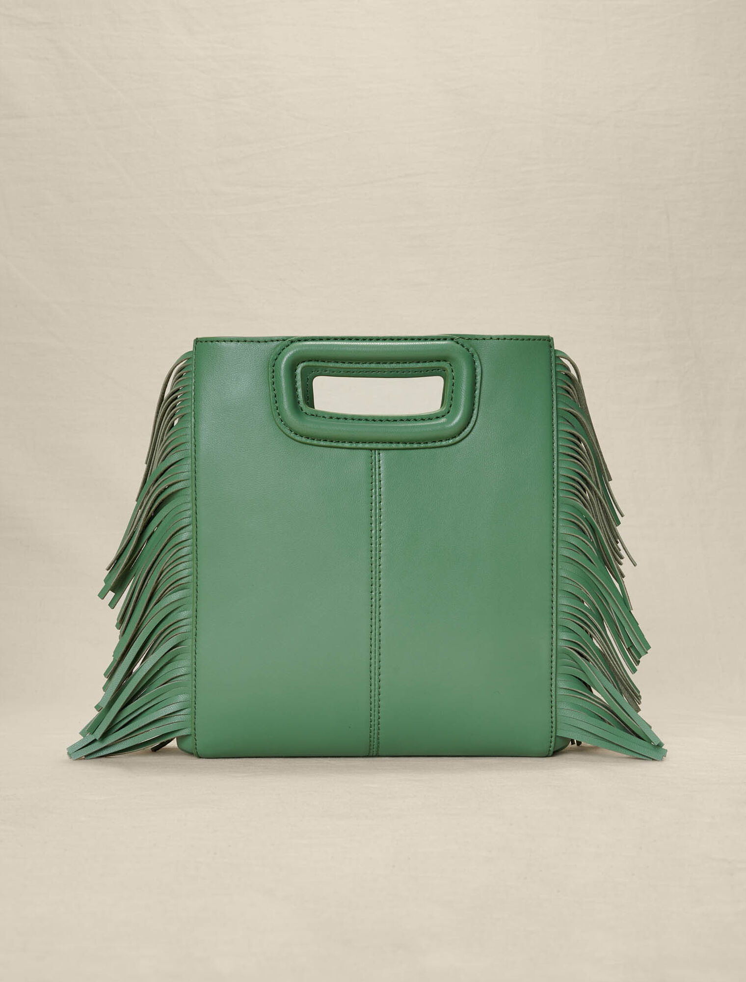 Bolso M con flecos de piel perforada