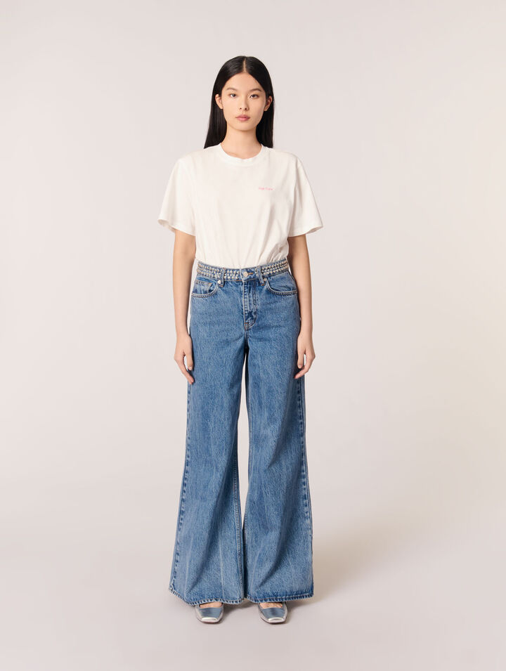 Jeans flare con cintura de clavos