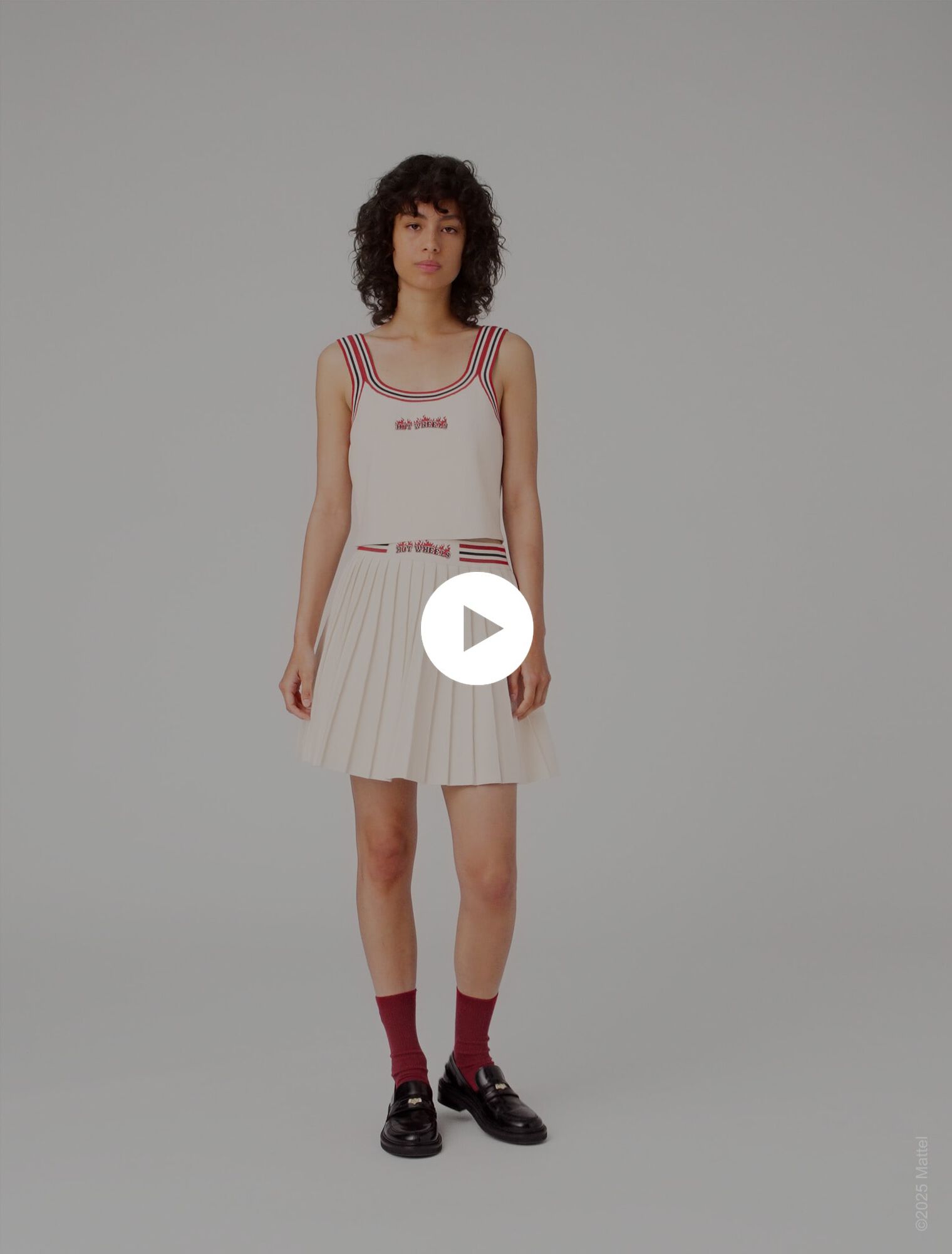 Falda corta plisada de punto