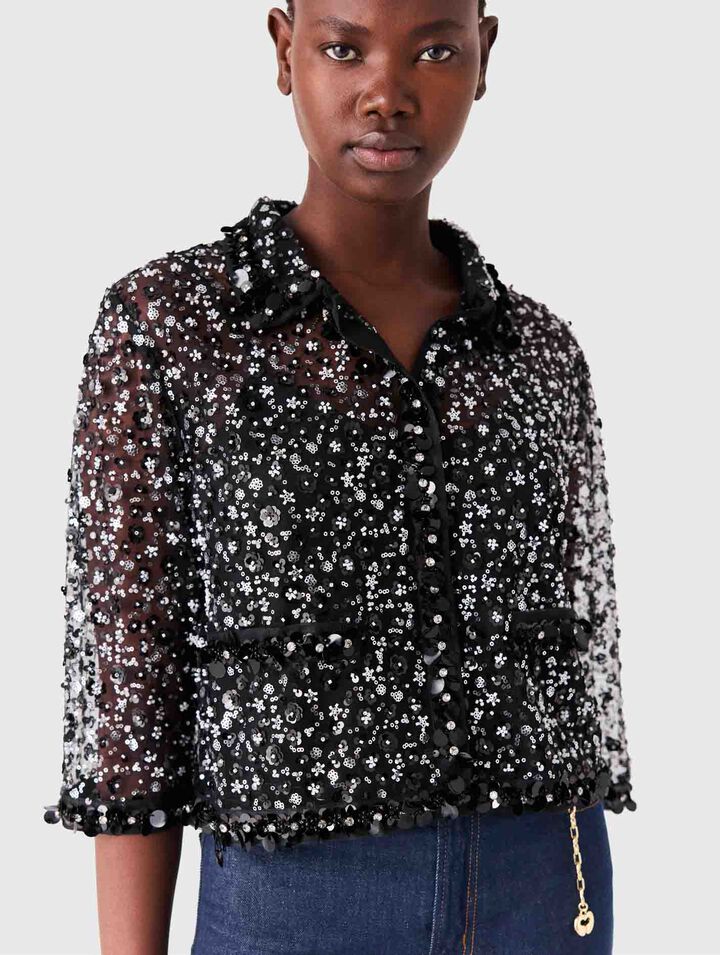 Polo con estampado floral y strass