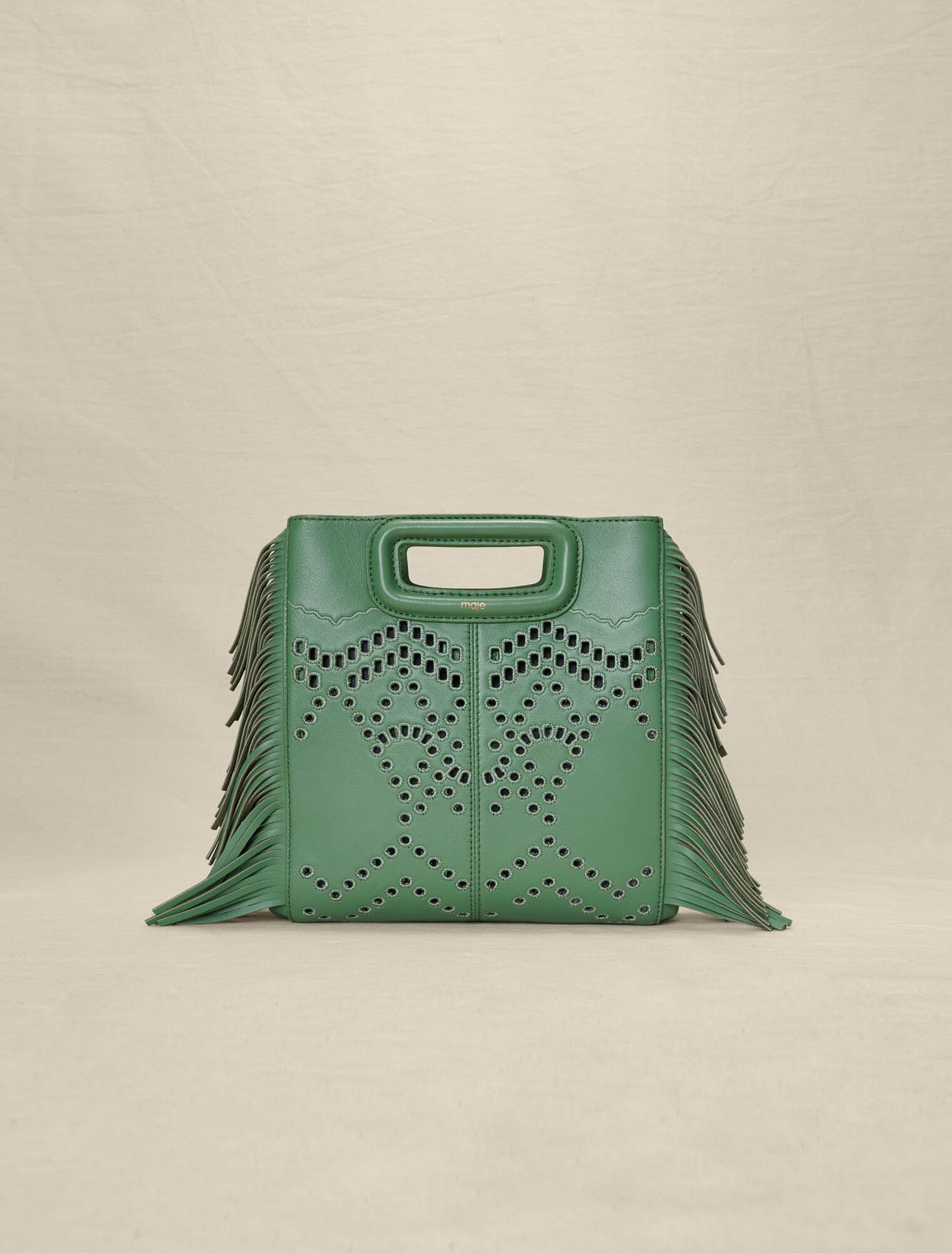 Bolso M con flecos de piel perforada
