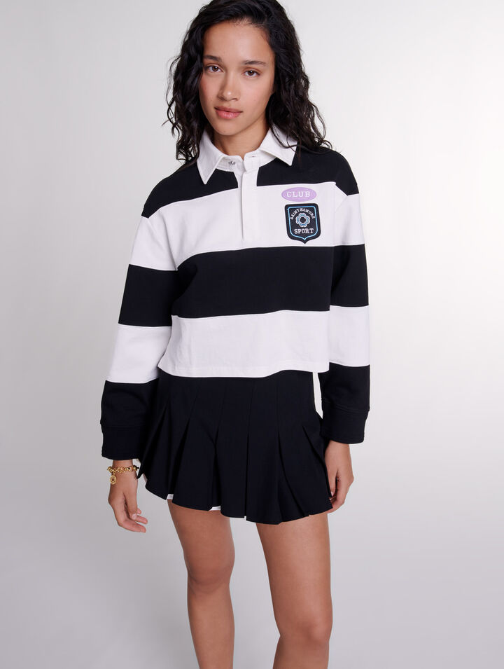 Falda short plisada de dos materiales