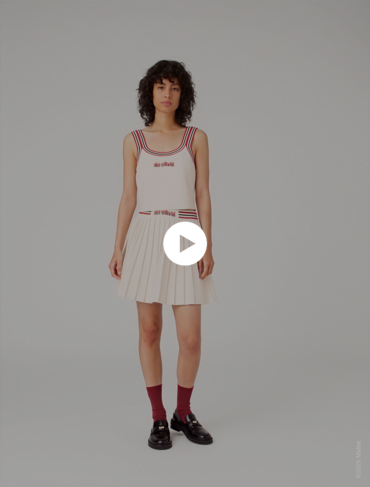 Falda corta plisada de punto