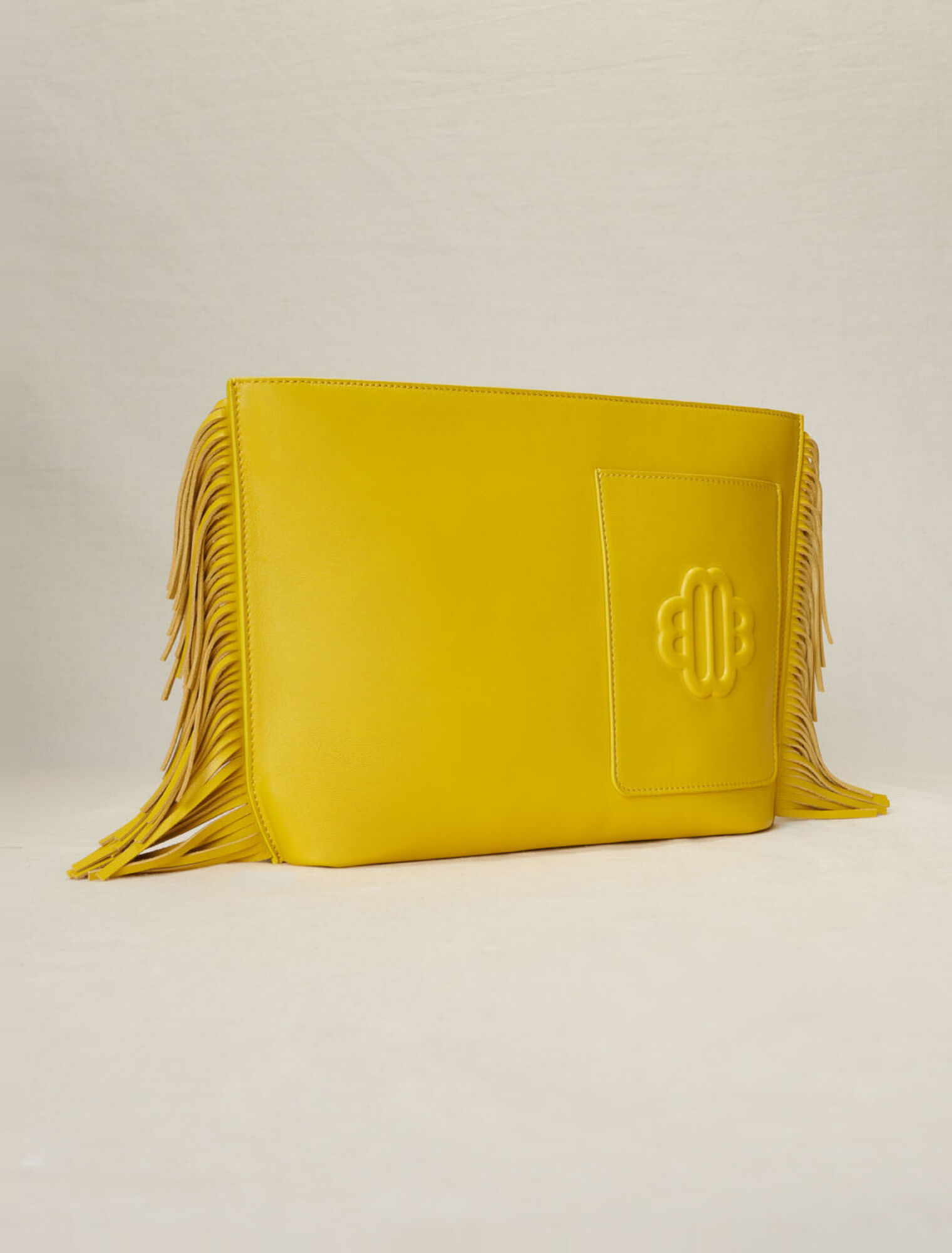 Bolso de mano de piel con flecos