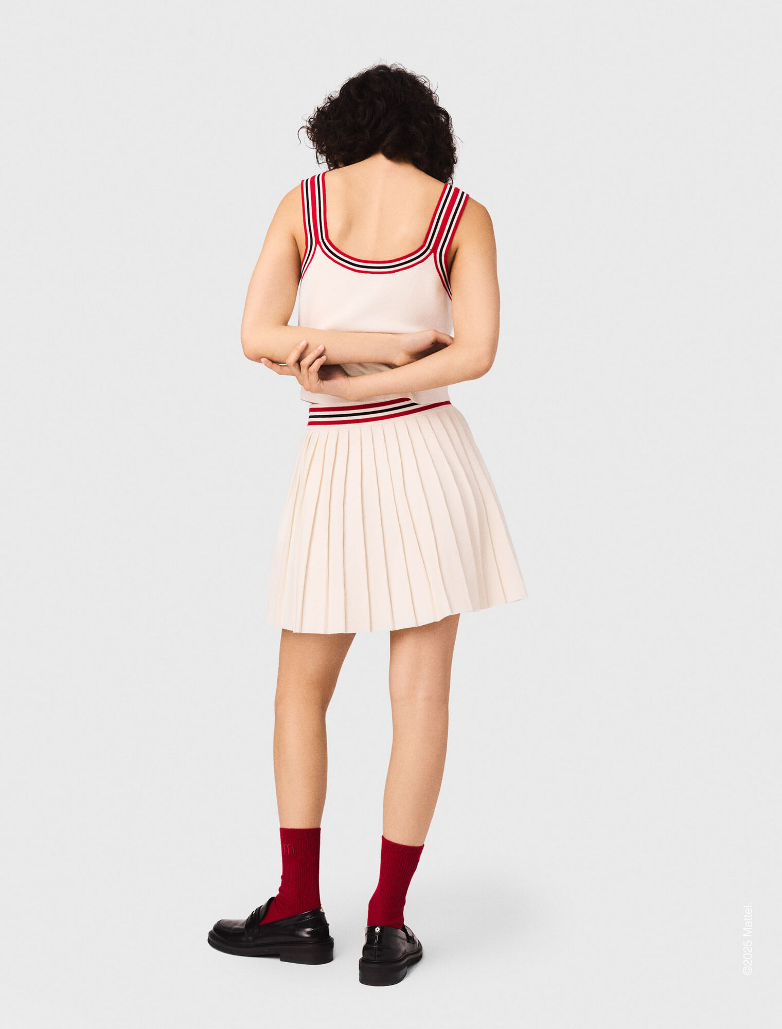 Falda corta plisada de punto