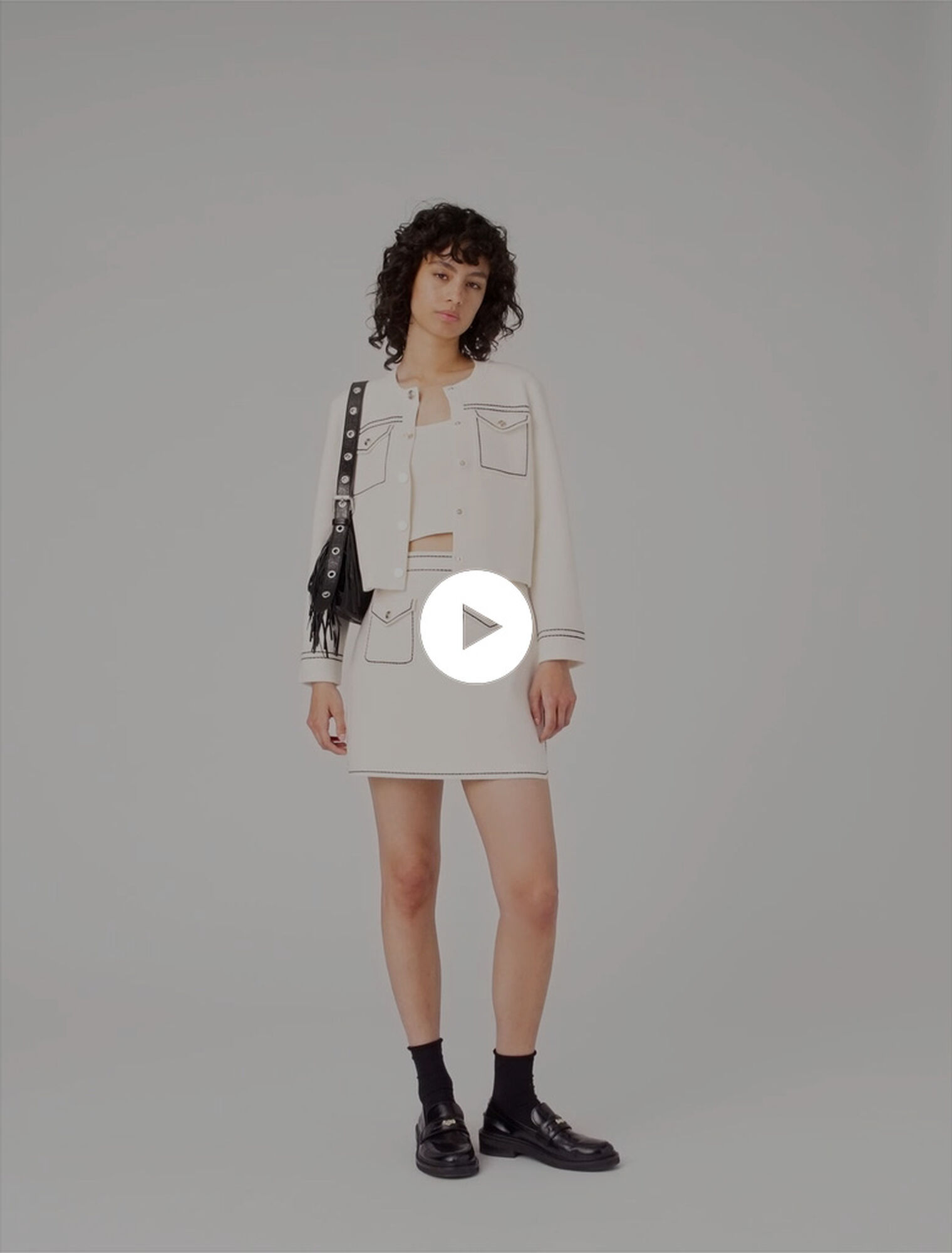 Falda corta de punto pespunteada