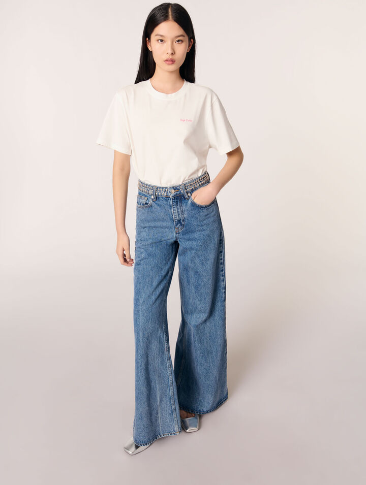 Jeans flare con cintura de clavos