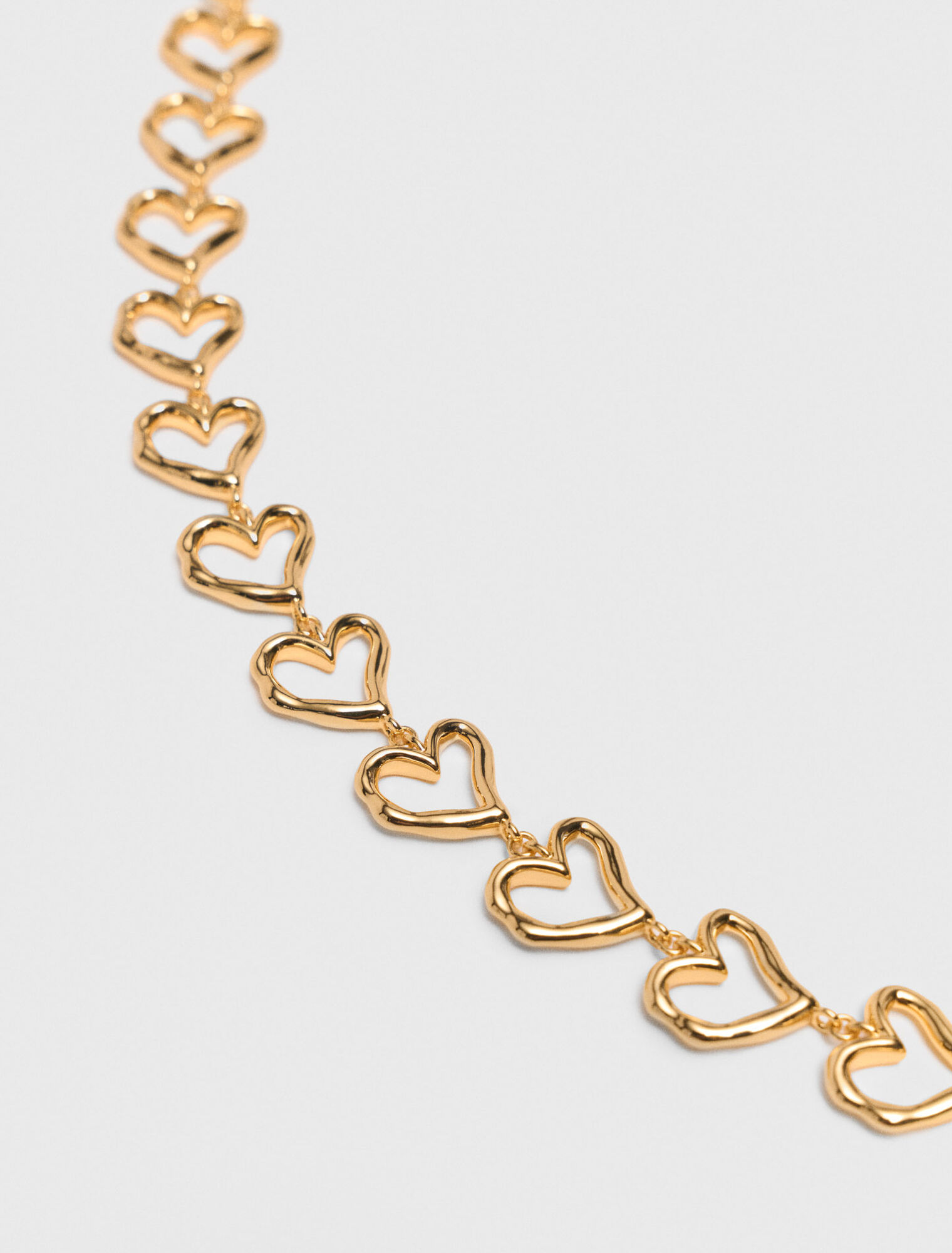 Collar corazón de latón dorado