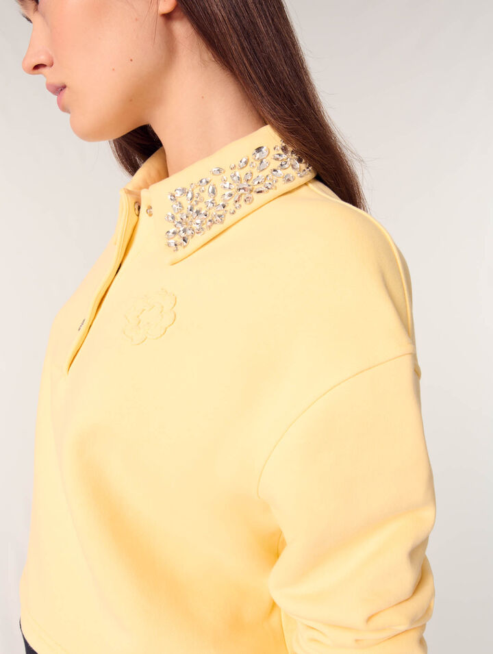 Sudadera corta con cuello joya